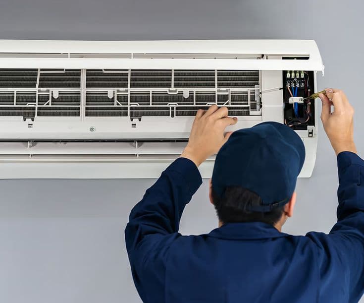 Electrician working on a circuit breaker